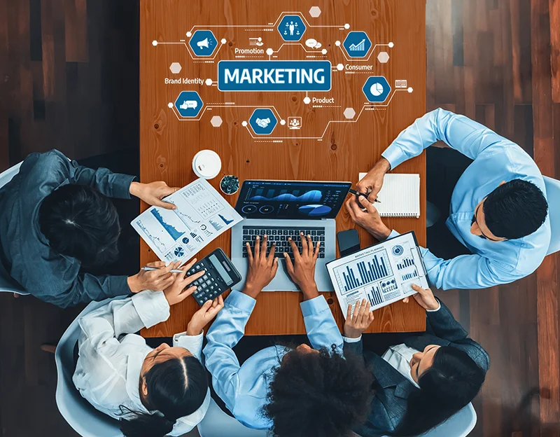 A diverse team of professionals actively collaborates on a marketing strategy