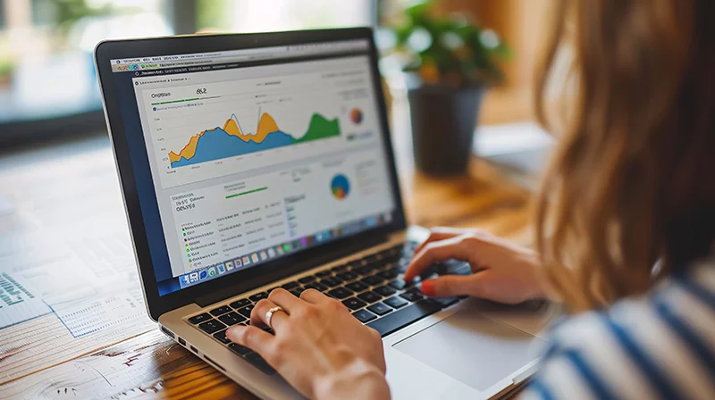  A digital marketer analyzing PPC campaign results on a laptop