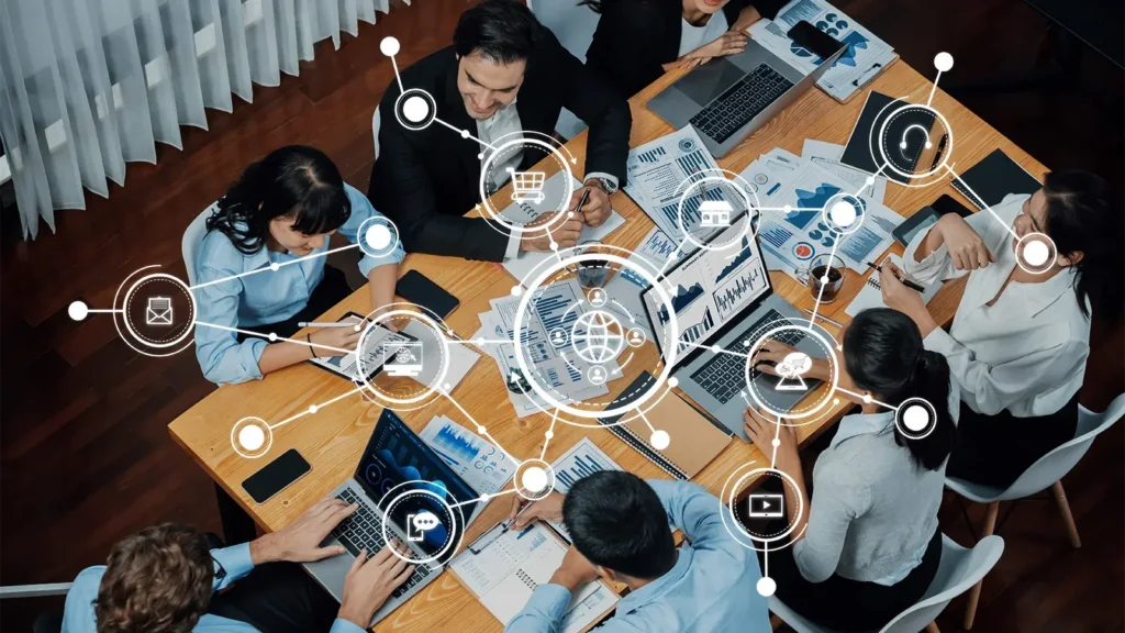 A modern office scene showcasing a collaborative team meeting focused on digital marketing strategies and business analytics