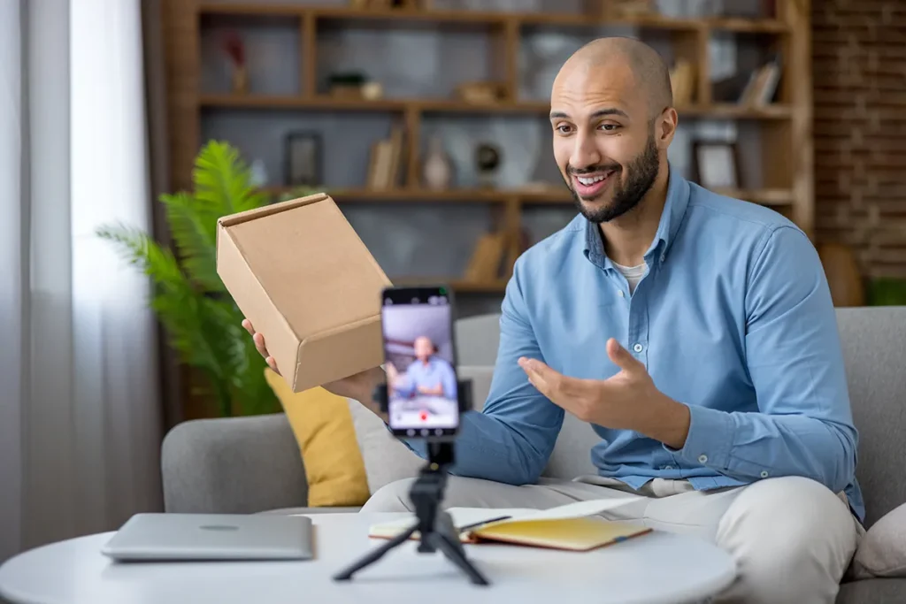 Man performing unboxing product review during live stream