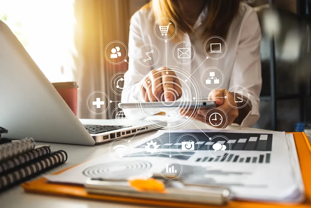 Digital marketing media in virtual screen. Businesswoman hand working with mobile phone and modern computer for conversion rate optimization (CRO)